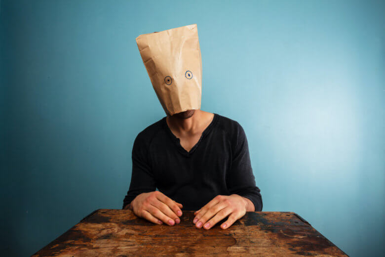 The Dunning-Kruger effect - a man with a bag over his head