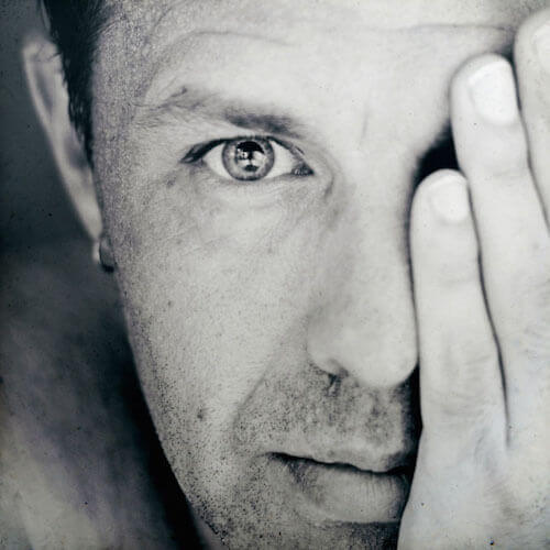 How to be happy: a man with hand over face